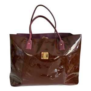 MCM Authentic Pre Owned Burgundy Tote Patent Monogram Bag with Gold hardware.